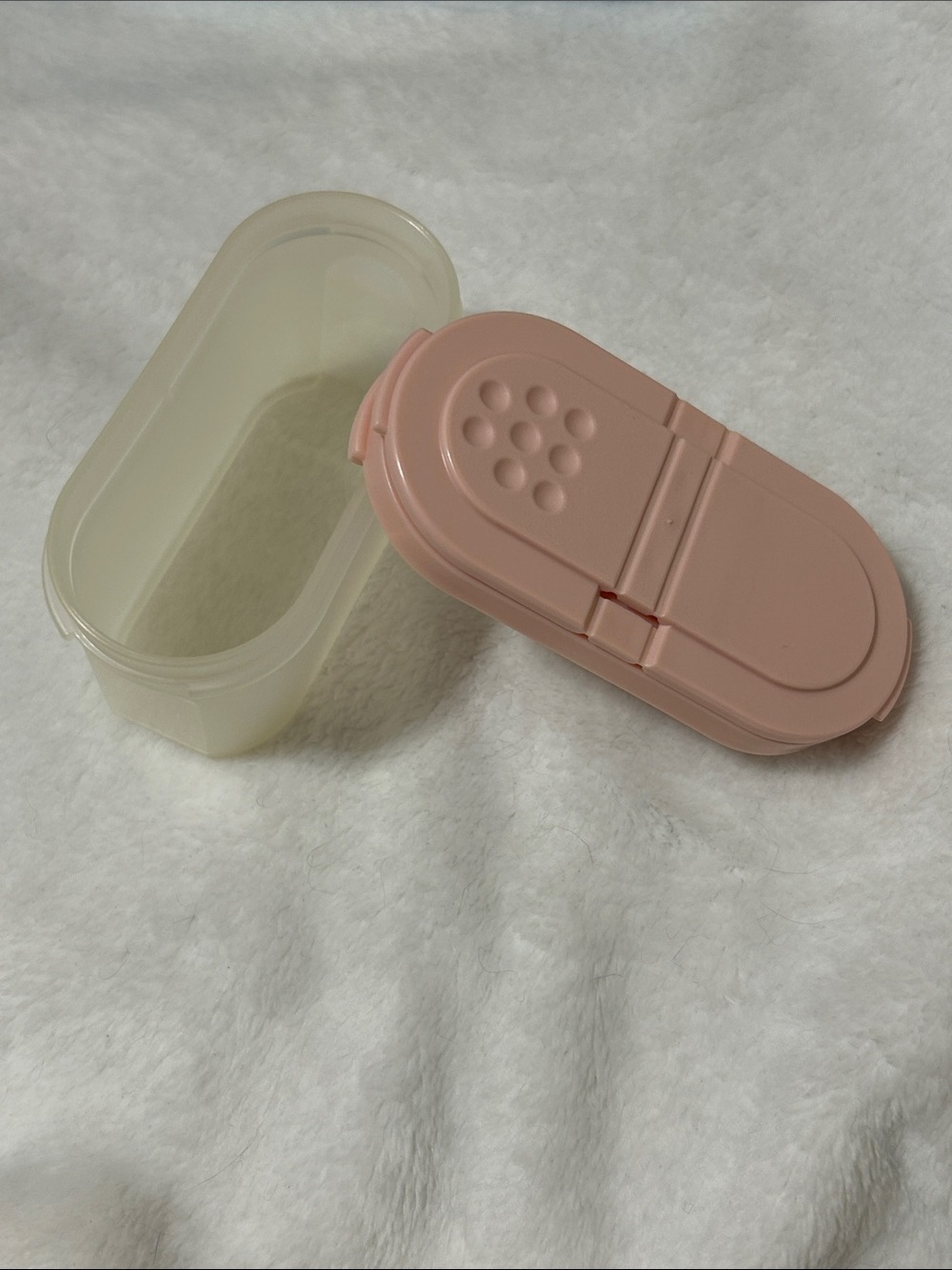 Tupperware set of 4 containers and 4 lids. 2 openings on lid for portion control